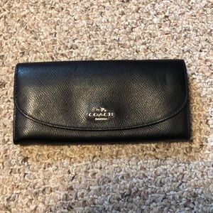 Coach black wallet with change zipper.